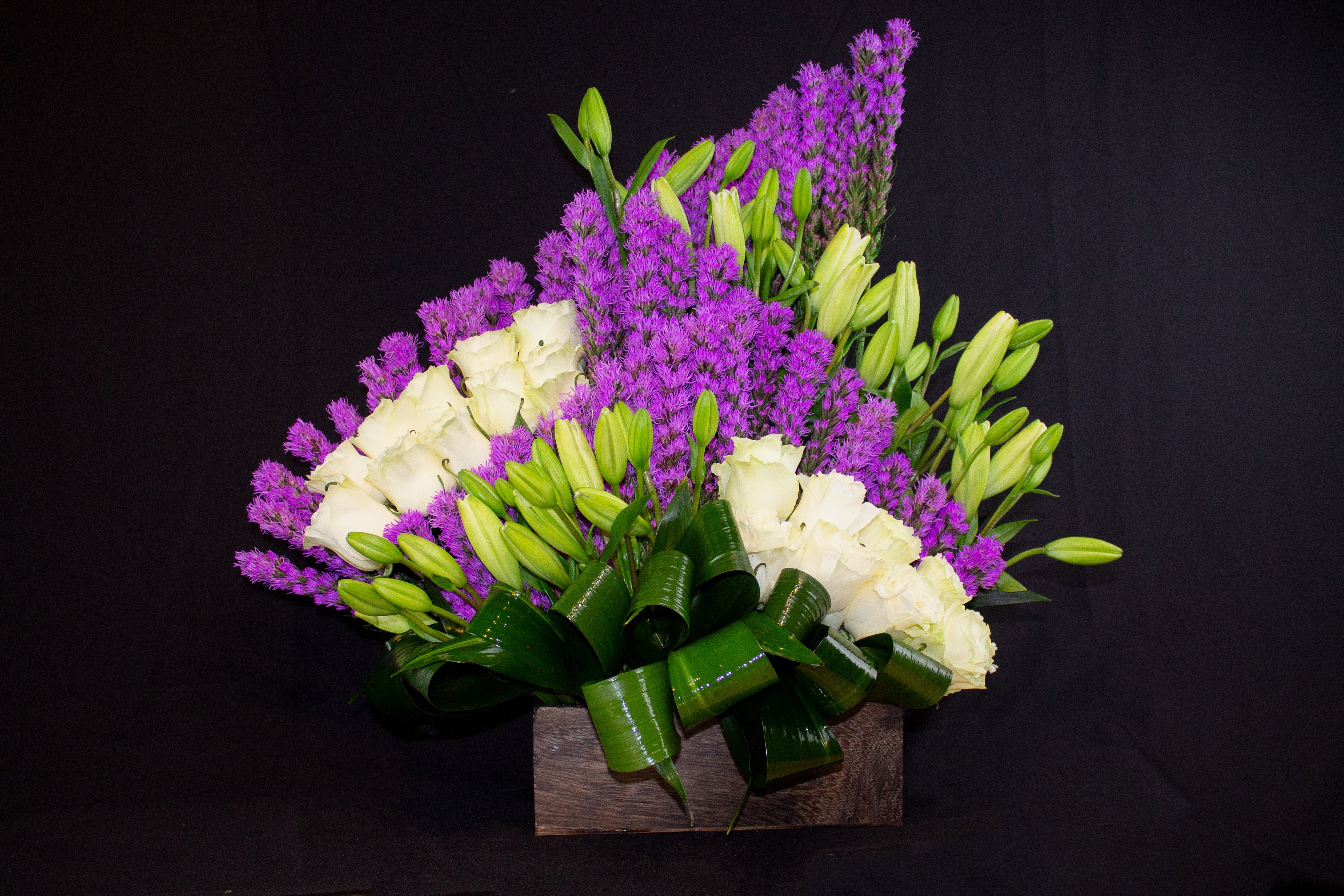 modern liatris flower arrangement with white roses