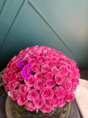 pink roses in clear fishbowl vase Miami florist