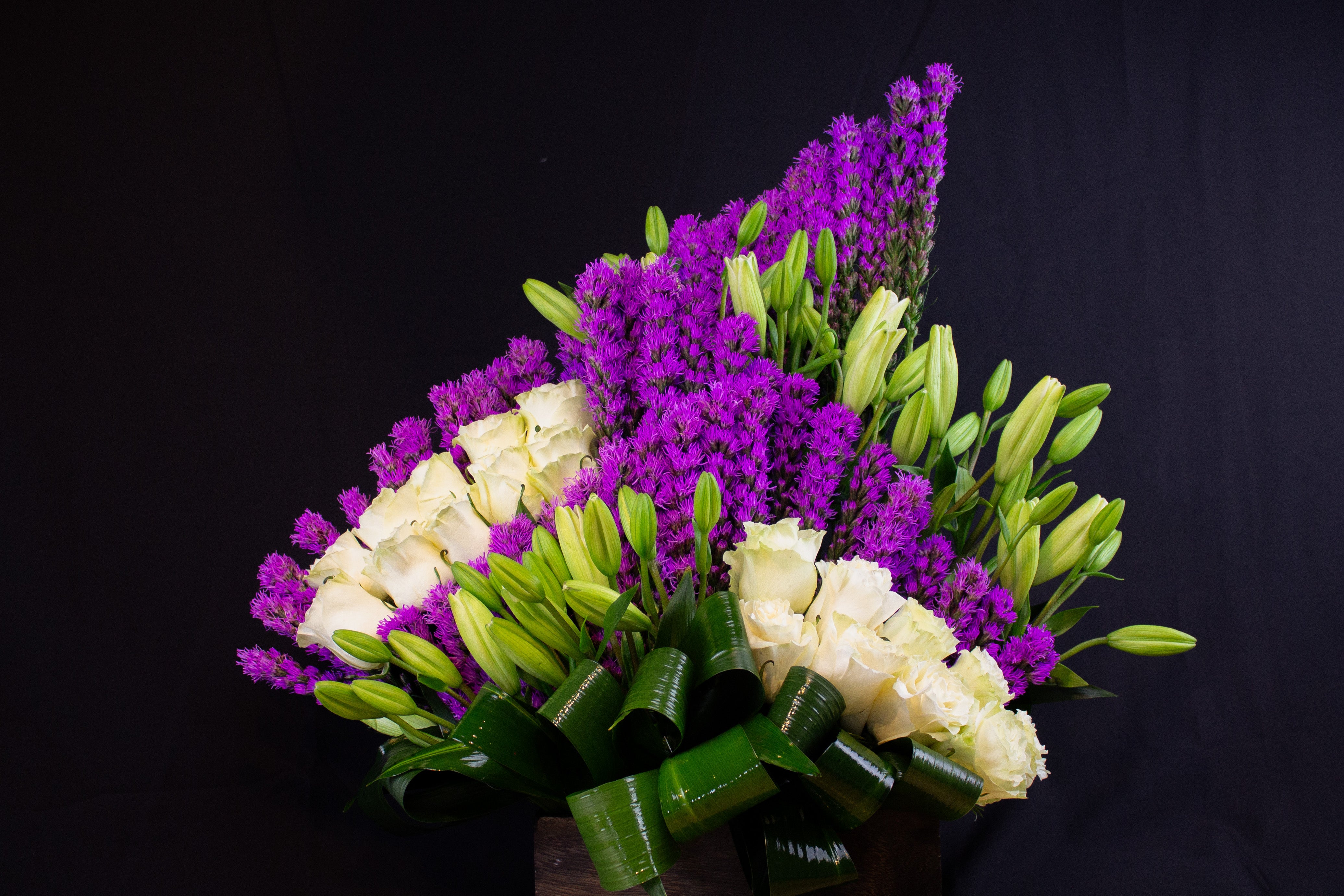 purple and white flower arrangement with lilies Miami