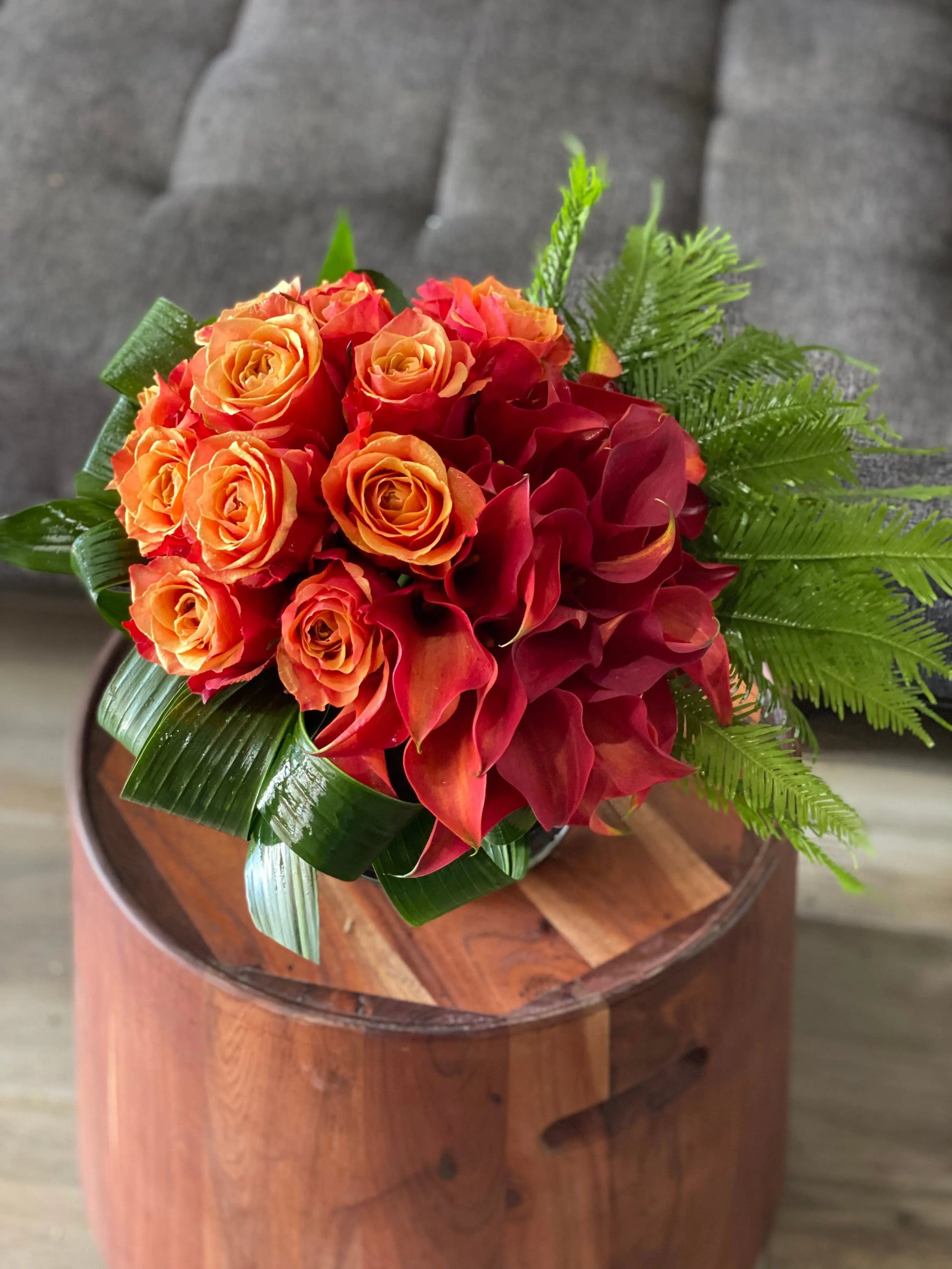 roses and calla lilies in a vase 
